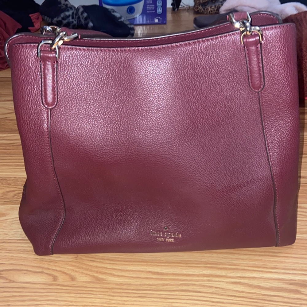 Maroon Kate Spade purse.